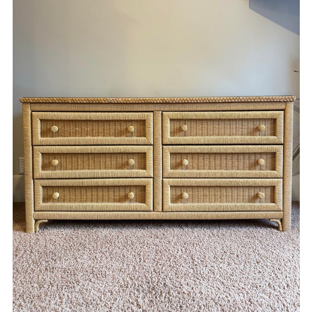 Bring the warmth and charm of coastal cottage style into your space with this Henry Link “Wicker by Henry Link” 6-drawer...