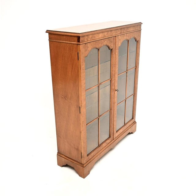 A smart and very well made antique burr walnut bookcase. This was made in England, it dates from around the 1930’s. The...