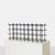 Description Modernist Iron Wine Rack A sculptural iron wine rack with plastic ball caps with storage for 24 bottles. Can...