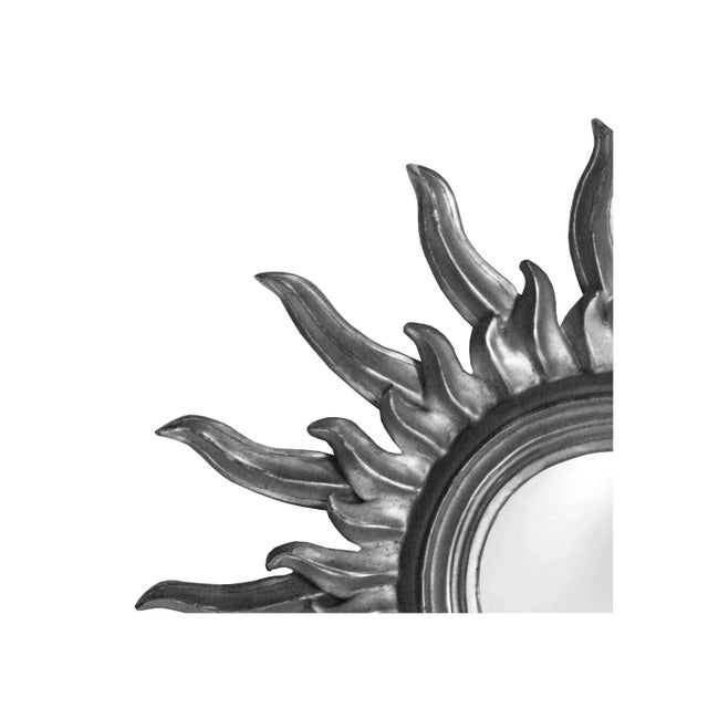 French mirror in the form of sun carved by polychrome hand finished in a silver bath.