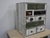Made of fir wood and lined with reclaimed wood. It features 8 drawers of various sizes. Original handles in iron, brass,...