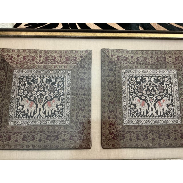 Nicely framed pair of lovely tapestries with elephant and peacock motif. Beautiful rich colors. Tapestries might actually...