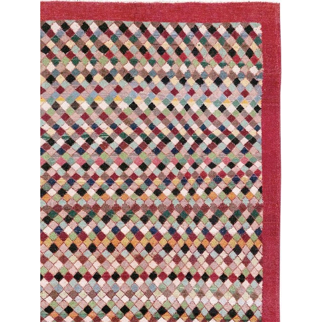 This Mid-20th century Turkish Anatolian room-size carpet presents a lively allover composition built from countless small...