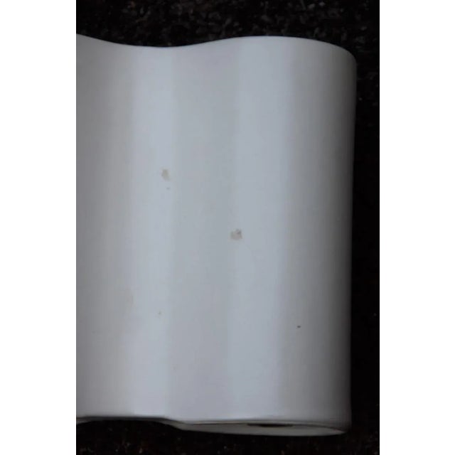 This Italian designed white convex vase is in the style of Angelo Mangiarotti.