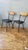 Refurbished Howell Metal Dining Chair Pair. c. 1960's. Tubular steel frame with refinished maplewood and bronze tone metal...