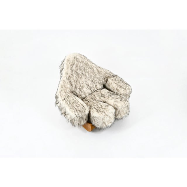 Rocking chair with wooden base and Yeti-shaped fur cushion designed by Mario Scheinchenbaue in the 1960s. Yeti model. Seat...