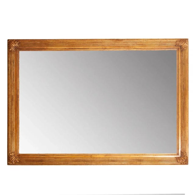 A gorgeous and massive French 19th century carved and painted gilt picture frame with new mirror plate. This hand-carved...