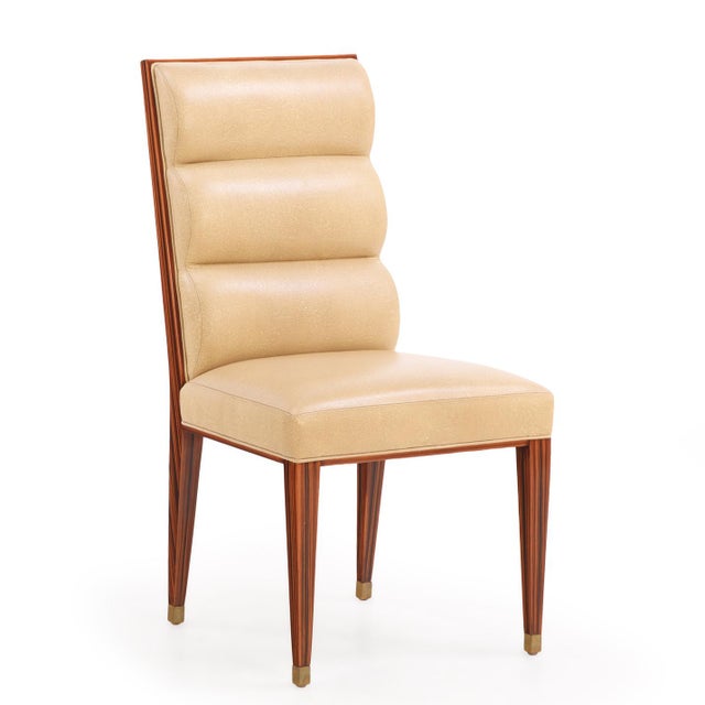 A set of 8 sensational custom made dining chairs in the style of Émile-Jacques Ruhlmann. Sourced from a Central Park East...