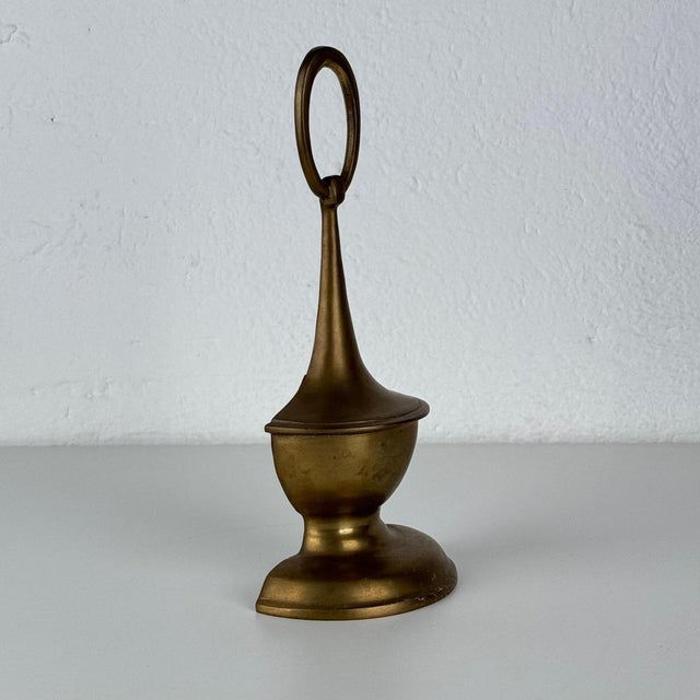 A refined and sculptural doorstop attributed to Luigi Caccia Dominioni for Azucena, dating to the 1950s — a poetic...