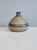 A distinctive oil lamp made of Danish studio ceramics, stamped with Bjergard, Danmark. The bulbous shape with its narrow...