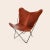 Cognac papillon chair by OxDenmarq Dimensions: D 90 x W 78 x H 97 cm Materials: Leather, Stainless Steel
