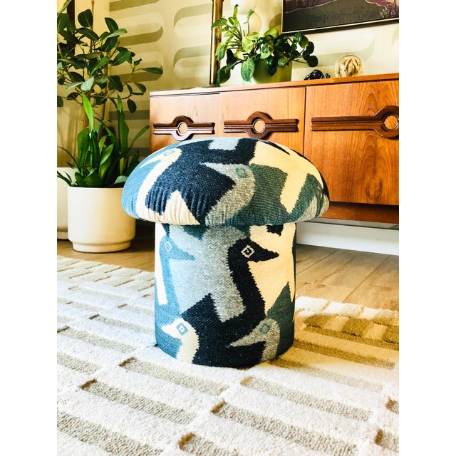 A handmade mushroom shaped ottoman, upholstered in a printed cotton abstract bird pattern. This fabric design consists of...