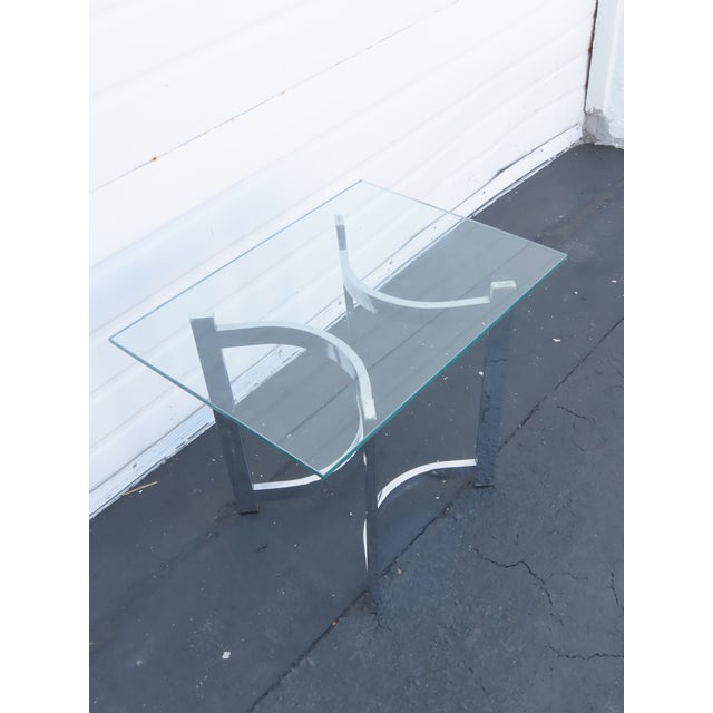 This beautiful Side Table is made out of metal, and glass. The Table has Hollywood Regency design, very interesting base...
