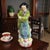 The product is a vintage Chinese Famille Rose porcelain figurine, hand-painted with intricate details depicting...