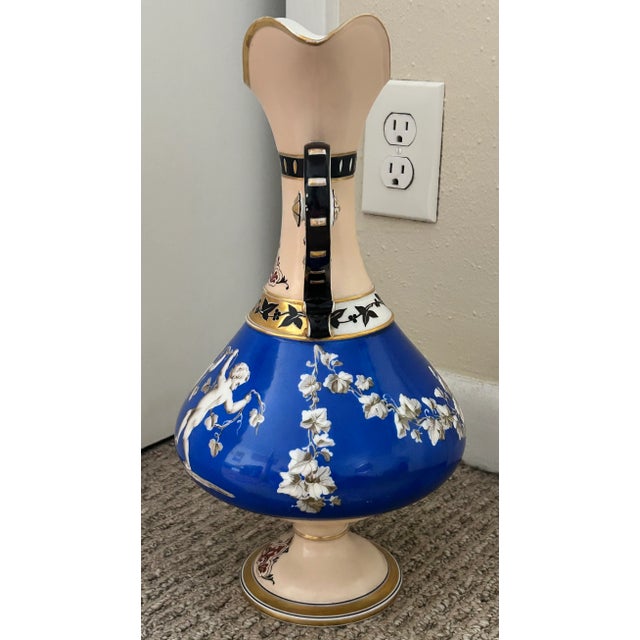 Mid 19th Century French Rococo Revival Porcelain Hand-Painted Gilded Bacchanal Putti Holding Vine Motif Double-Handled Footed Baluster Vase For Sale - Image 4 of 7