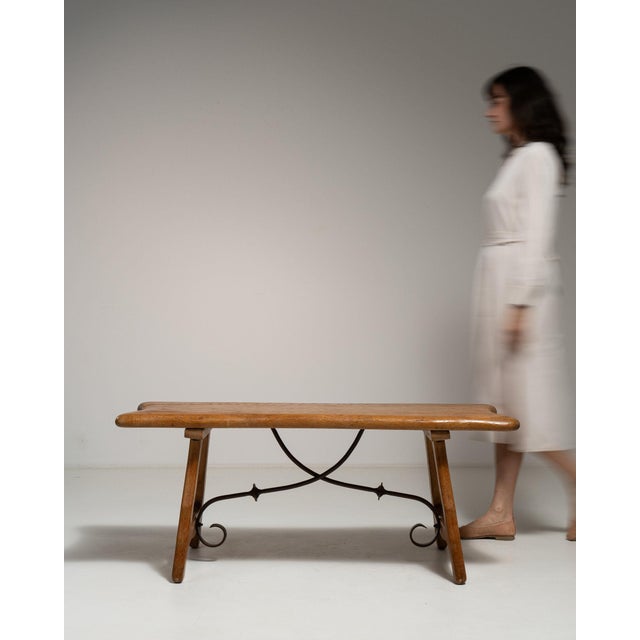 This piece presents as a console table, distinguished by natural honey oak live-edge top, sculptural legs. It was made in...