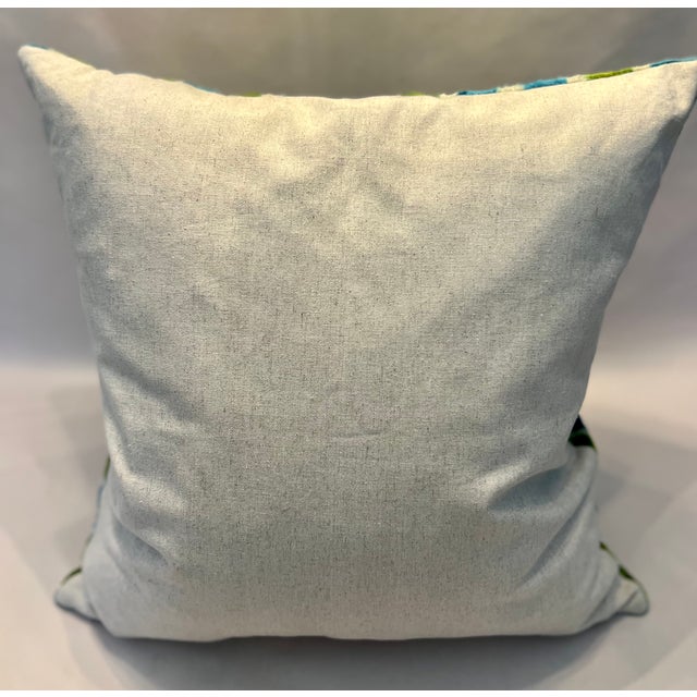 Classic and versatile, the 20” x 20” Silk Velvet Blue & Green Pillow is handmade in Turkey on traditional small looms,...