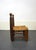 Low fireplace chair in solid wood with a rush seat. A mid-20th-century French handcrafted piece in the style of French...