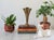 Vintage brass fluted trumpet vase with a scalloped rim and pedestal base. No makers mark. Patina.