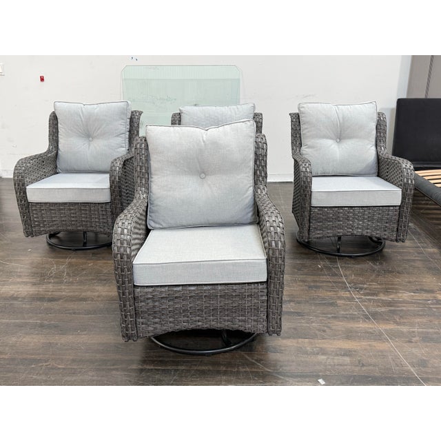 Design Plus Gallery presents a Set of Four Gray All Weather Wicker Outdoor Swivel Glider Lounge Chairs. Each chair has a...