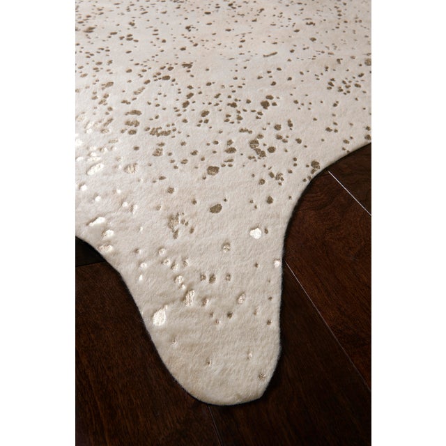 A compelling variant of the timeless cowhide rug, the Bryce Collection touts rich metallic accents set against versatile...