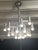 Gaetano Sciolari chandelier, rare model, height 90cm, 16 lights, sold without bulbs. This piece is attributed to the...