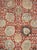 This early 20th-century Persian Tabriz rug presents a richly ornamented allover floral composition across a warm red...