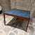 For your consideration, a mid-century modern Danish accent table features a rich wood frame inlaid with a vibrant blue...
