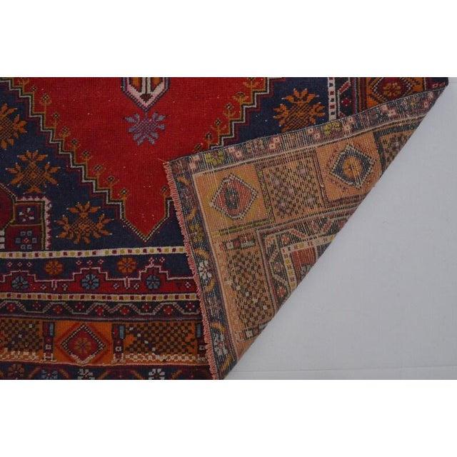 Vintage Anatolian Wool Area Rug, Bold Red Field With Navy Blue Geometric Medallion For Sale - Image 9 of 10