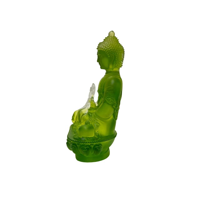 The Green Crystal Glass Lotus Cross Leg Medicine Amitabha Shakyamuni Buddha figure is a stunning representation of...