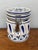 Ceramic kitchen canister hand painted in cobalt blue on a white glaze in a Delft style. A flower medallion decorates the...