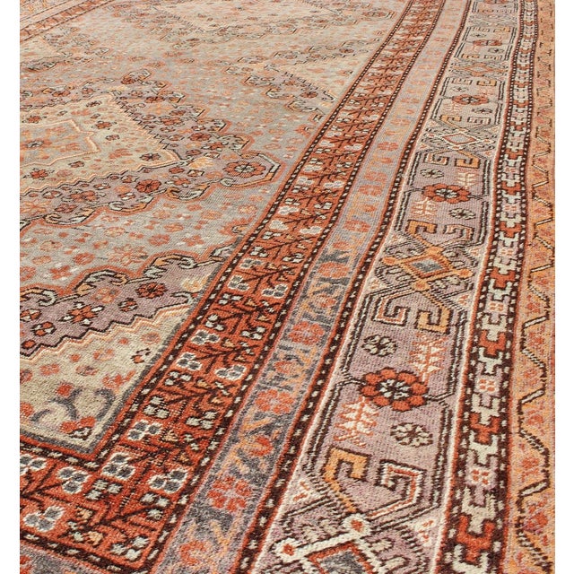 Textile Antique Khotan Rug With Medallion Design in Muted Blue, Rust, and Soft Beige 6'6"x13'0" For Sale - Image 7 of 7
