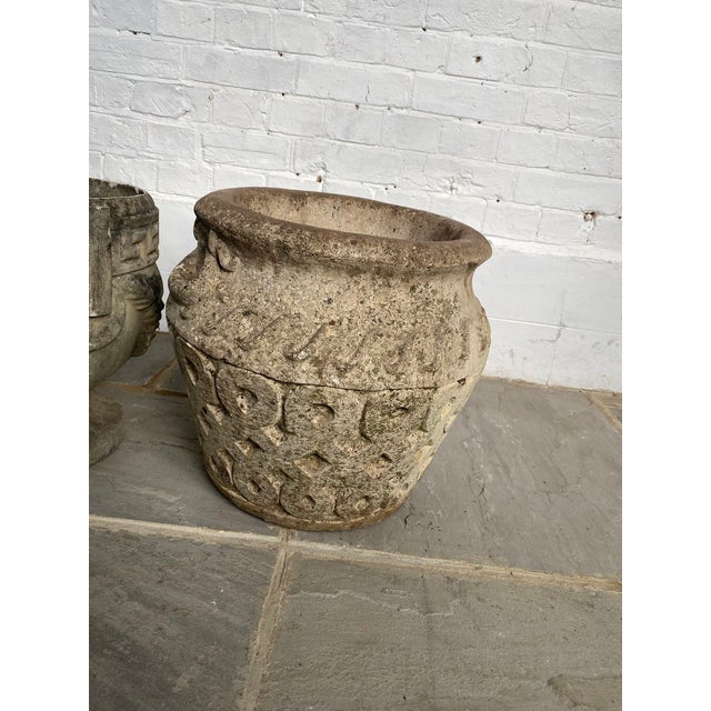 This mid-20th century English reconstituted stone planter embodies Celtic style. The round planter tapers to a smaller...