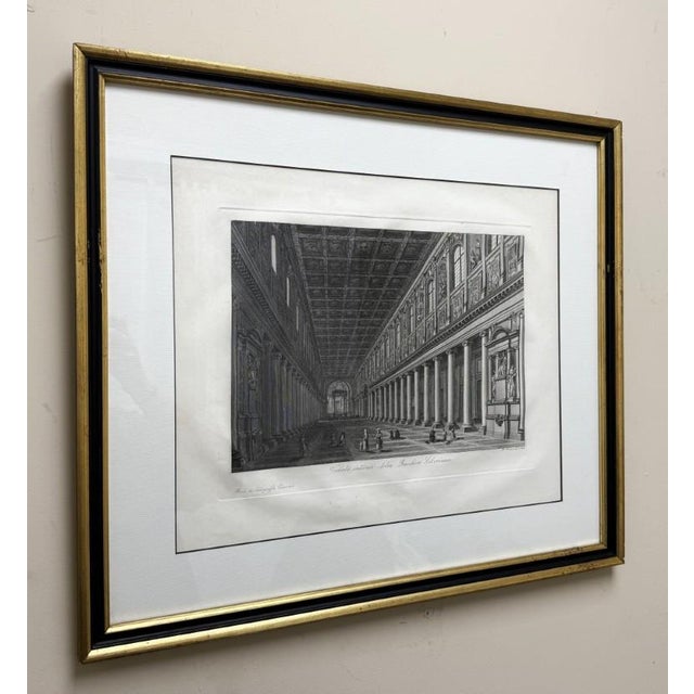 This 19th Century Engraving depicts the grand interior of the Basilica of Santa Maria Maggiore in Rome, showcasing its...