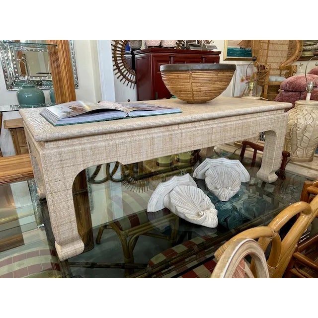 Wonderful Harrison Van Horn raffia wrapped coffee table to float in your space.