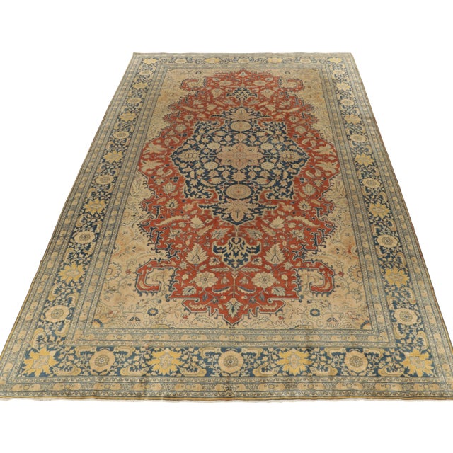 Celebrating the fine lineage of Persian rugs, Rug & Kilim welcomes this 11x17 Tabriz rug of the 1920s to its reputed...