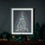 Add a touch of glamour to your holiday decor with the Holiday Jewel Tree Print Under Glass. Featuring chic wintry blue and...