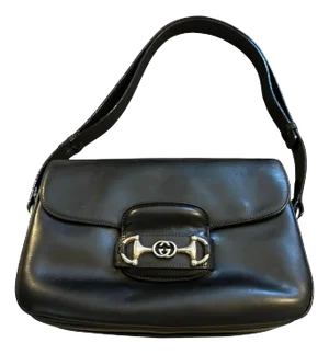 A 1970s Black Leather Shoulder Bag by Gucci