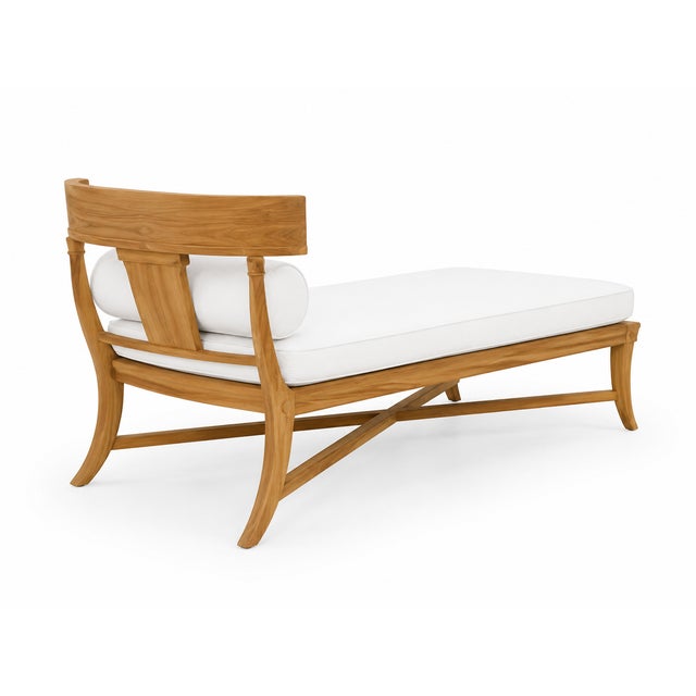Modern Klismos teak outdoor chaise. Chaise is in like condition. Newly upholstered. Solid and in beautiful condition. 70’’...