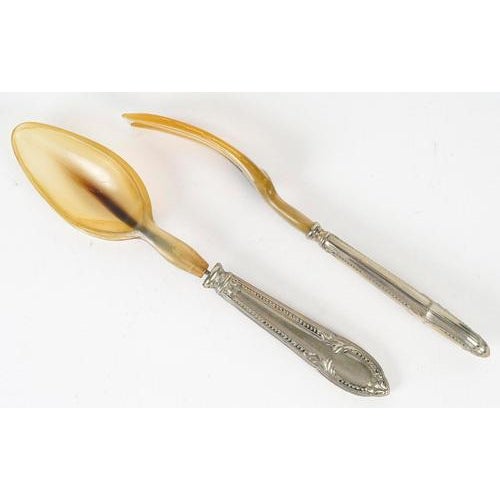 Pair of silver plated and horn salad servers. A pair of louis xv style silver and horn salad servers, 19th century. H:...