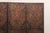 A large-sized Italian embossed and painted leather room divider, with nail head trim accents, from the mid 20th century....