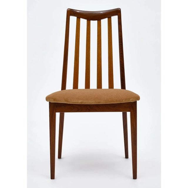 Set of eight chairs from England signed by Leslie Dandy for G-Plan. They have strong teak frames finished in a lustrous...