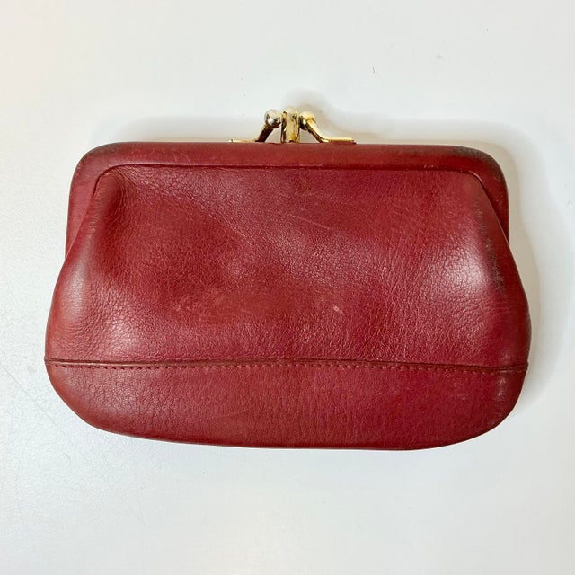 Vintage Home is pleased to offer this 1996 Vintage Red Leather Coach Coin Wallet. It has two compartments with a twist...