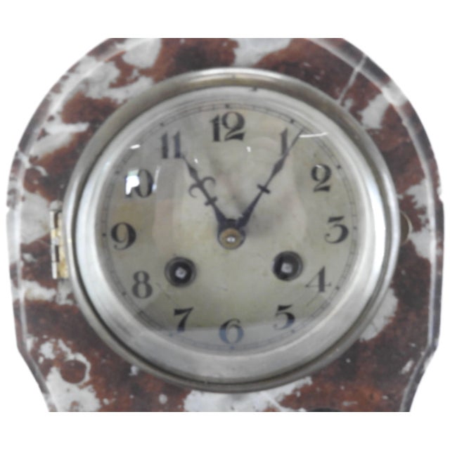 Lovely brown and white marble make up this matching set consisting of a clock and a pair of pedestals. The clear glass of...