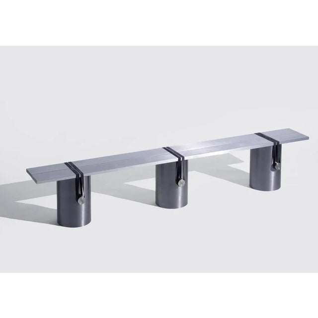 Anodised contemporary bench by johan viladrich material: anodised aluminum, rubber measures: l200 x w24 x h38 cm approx....
