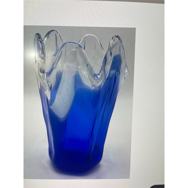 Striking vintage cobalt-blue art glass bowl or vase with a dramatic freeform ruffled rim and sculptural silhouette. This...