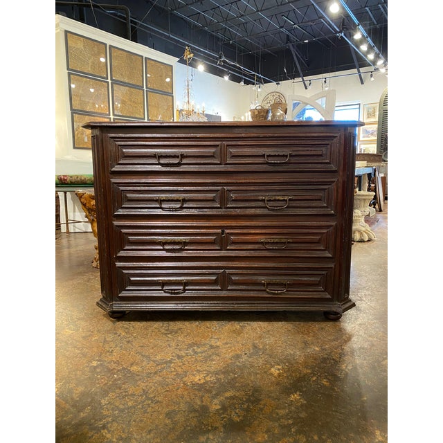 Italian 18th c walnut commode. 4 bold geographic molded drawers drawers with original pulls. 54” l x 27” w x 40.5”h 35-800