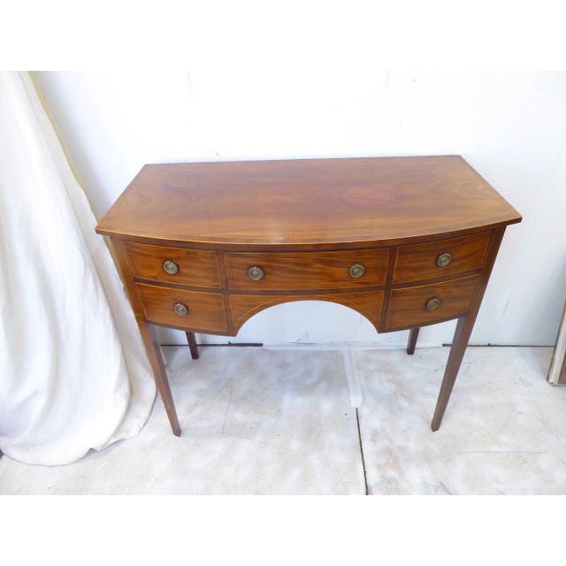 This English mahogany sideboard has easily sliding drawers, dove-tailed oak drawers and measures 33"H x 38.5"W x 20"D.