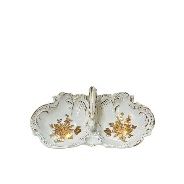 Perfect size for serving holiday dishes. White porcelain double bowl serving dish with handle. Roses adorn the center. Not...