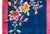 This vintage Chinese Art Deco rug from the 1930s features a vibrant, deep blue field framed by a striking magenta-pink...